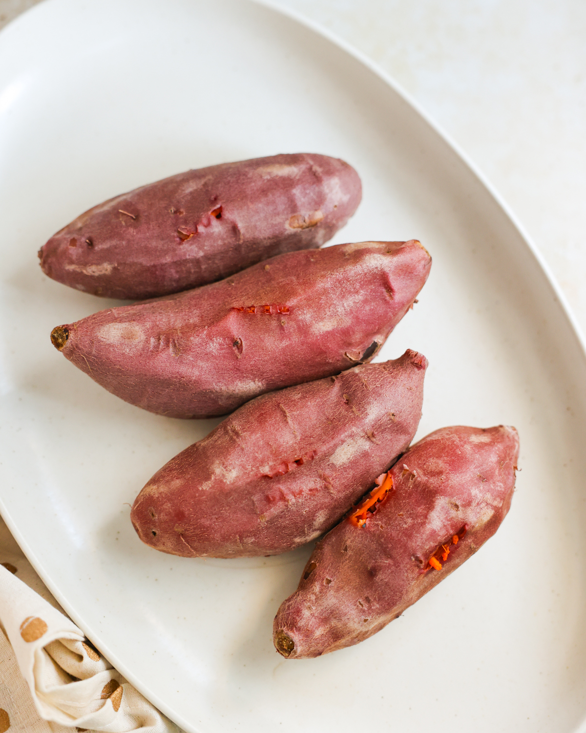 overhead sweet potatoes cooling on a platter
