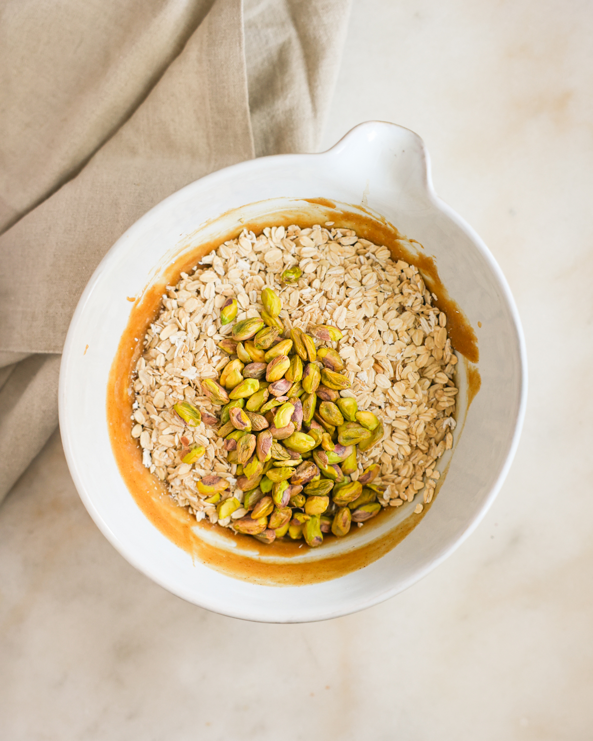 oats and nuts added to mixing bowl