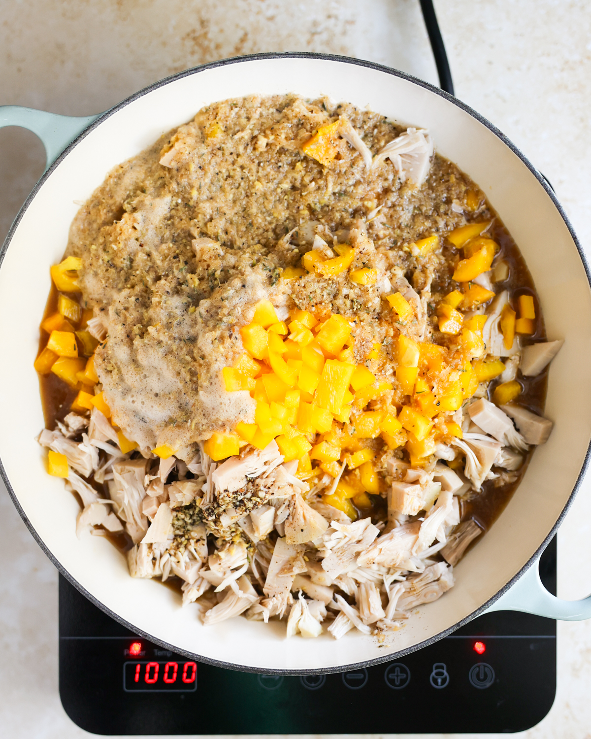 overhead jerk sauce added to skillet