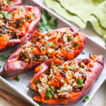 Stuffed sweet potatoes on platter.
