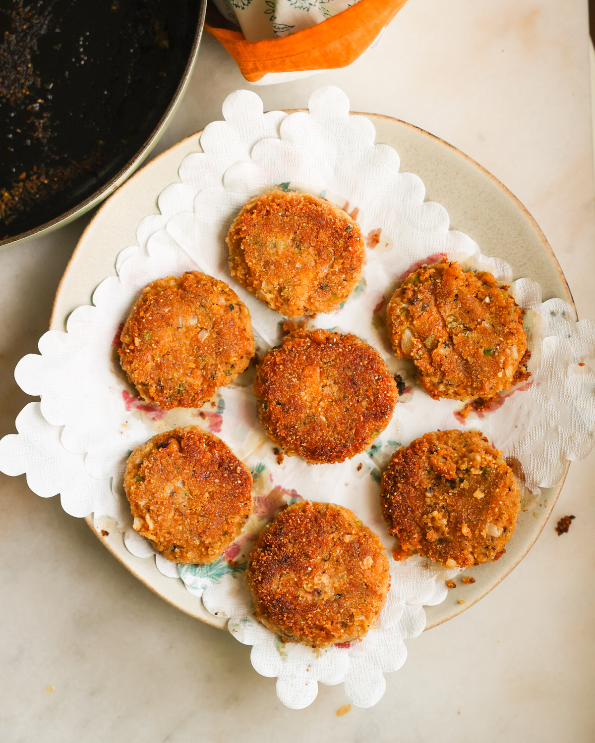 black eyed pea fritters draining on paper towel.