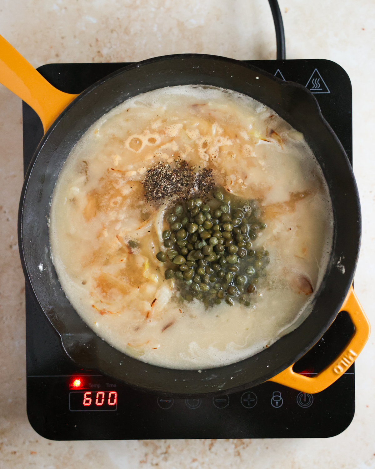 overhead piccata ingredients in pan