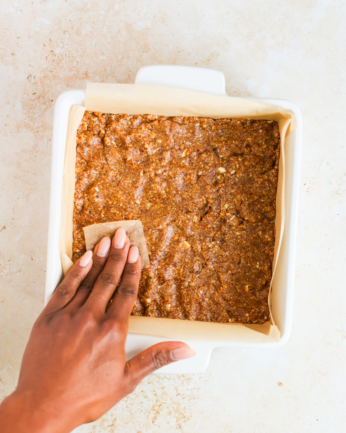 overhead pressing gingerbread crust in tray