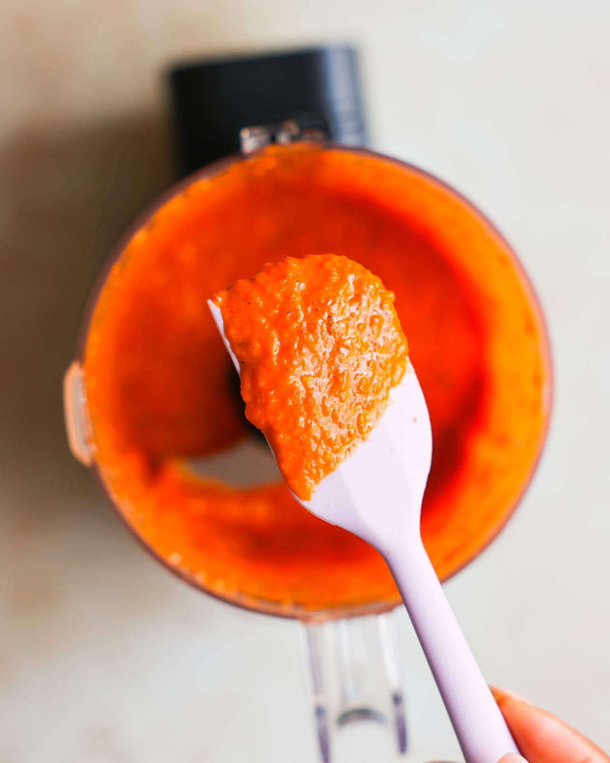 red pepper sauce on spatula