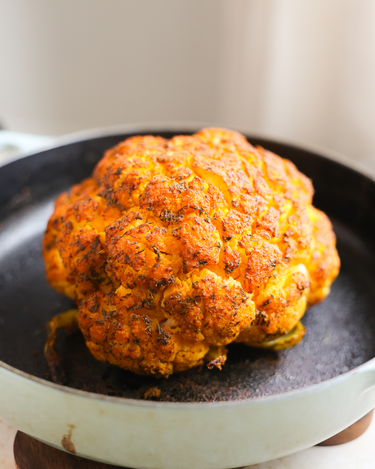 whole roasted cauliflower in pan
