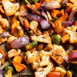 Roasted vegetables on a baking pan.