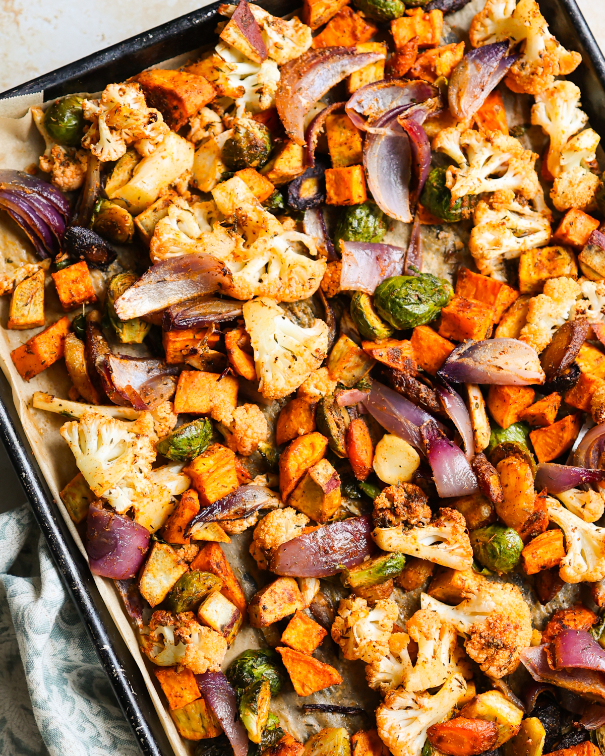 Roasted vegetables on a baking sheet. 