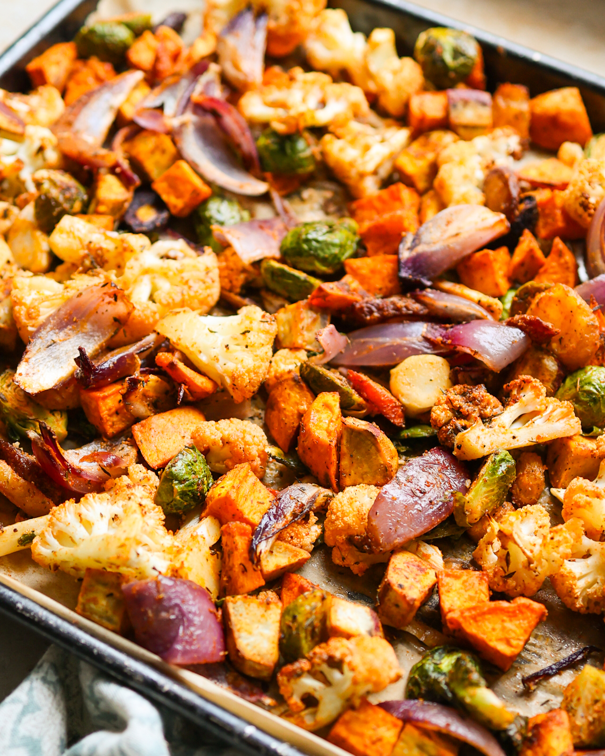 Roasted veggies on a baking sheet. 
