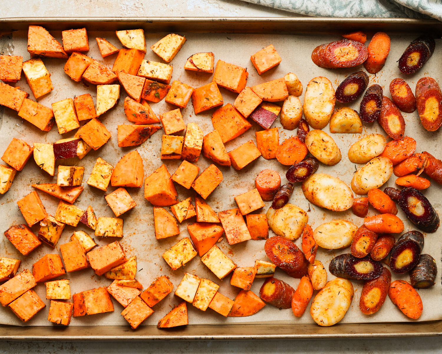 Root vegetables on a baking sheet.