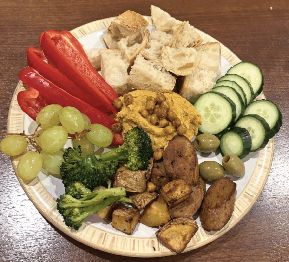 Sweet potato hummus with veggies on a plate.