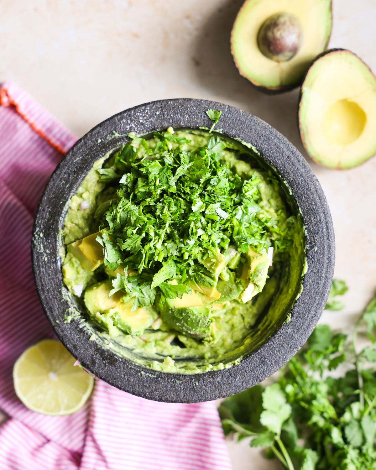 Cilantro added to guacamole.