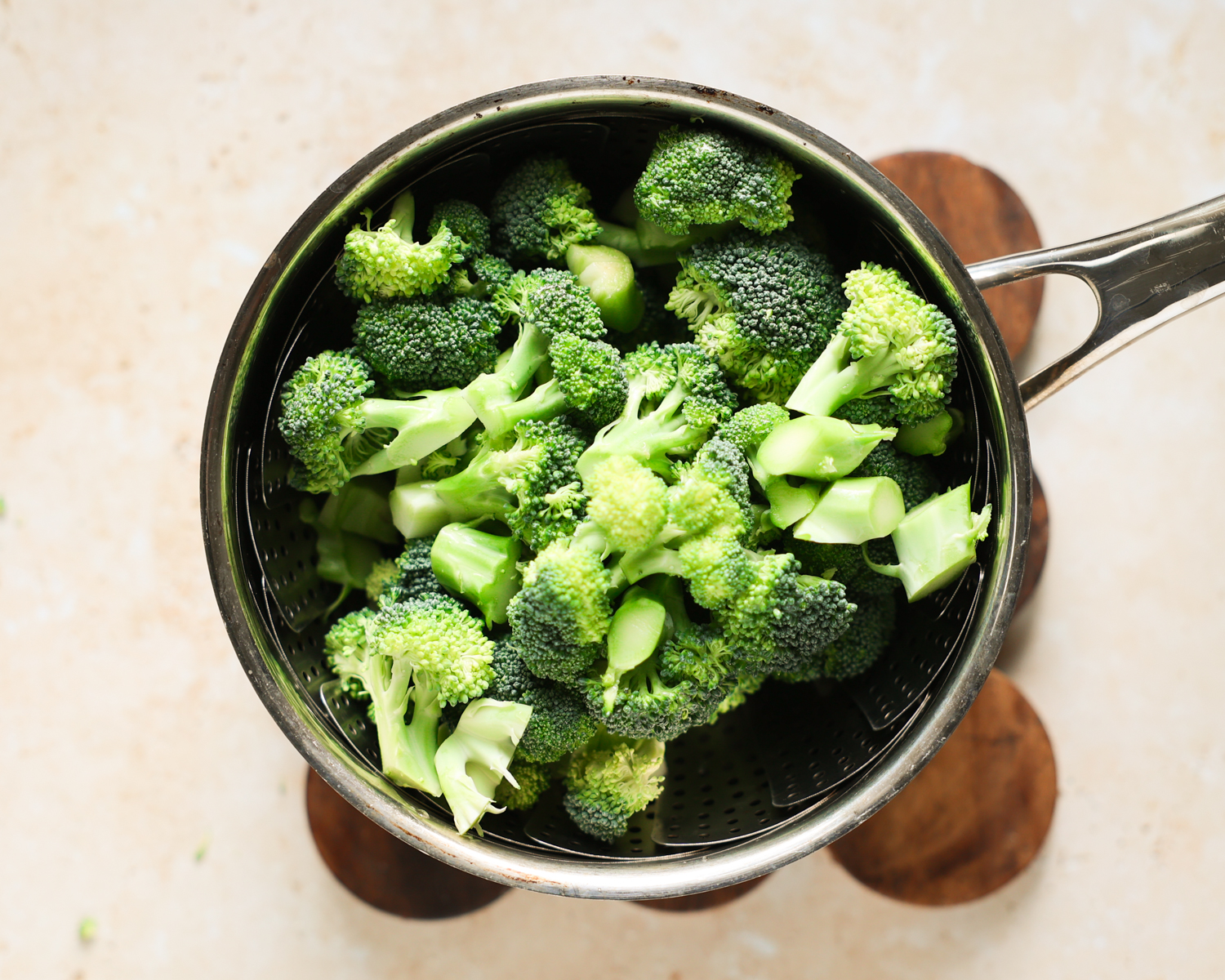Broccoli in steamer basket.