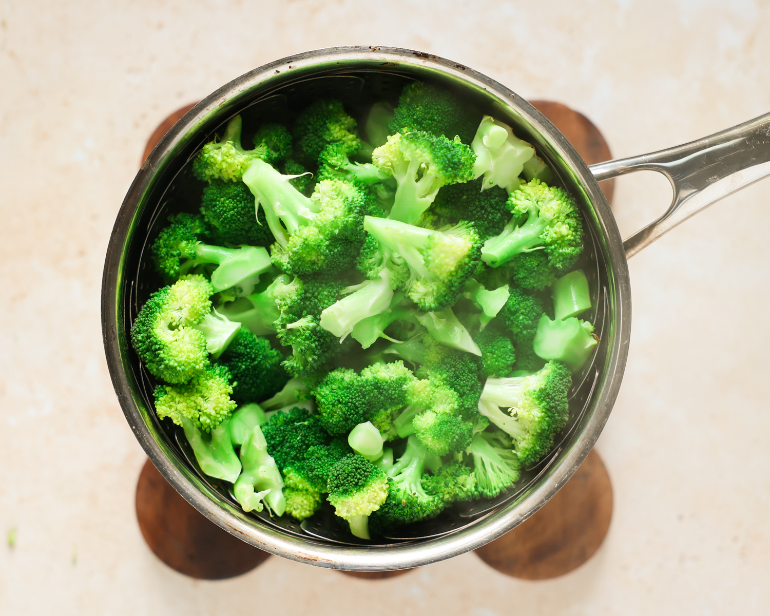 Steamed broccoli in basket.
