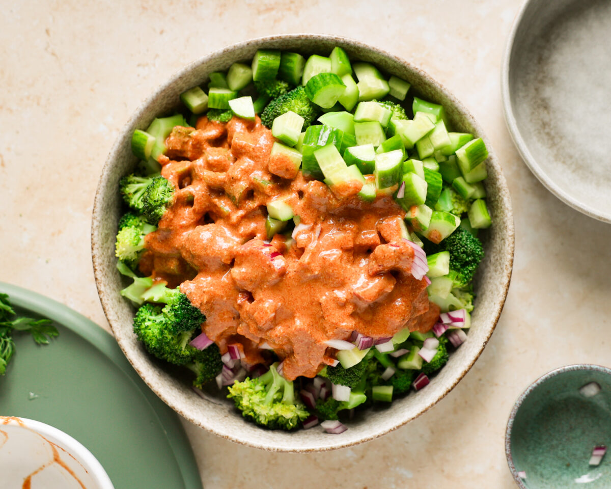 Broccoli salad ingredients in a mixing bowl.