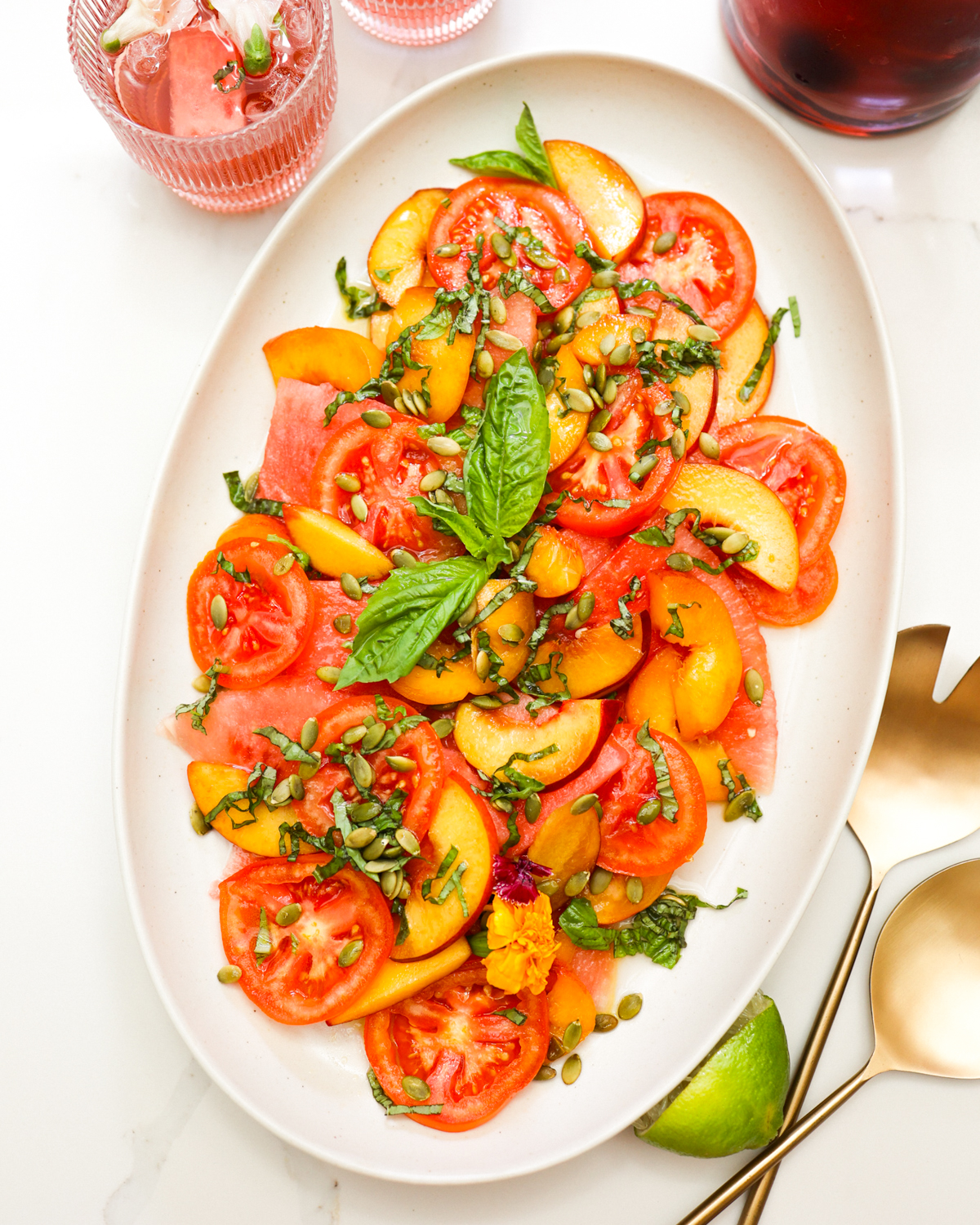 Peach and watermelon salad on a platter.