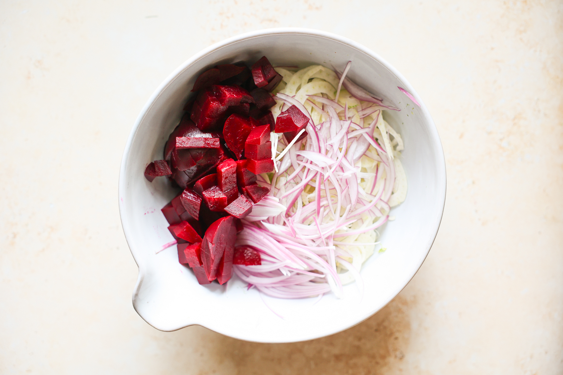 Fennel salad ingredients in a bowl.