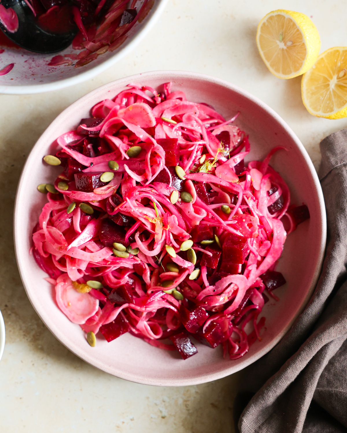 Pink fennel salad on a plate.