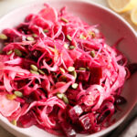Crispy and pink fennel salad on plate.