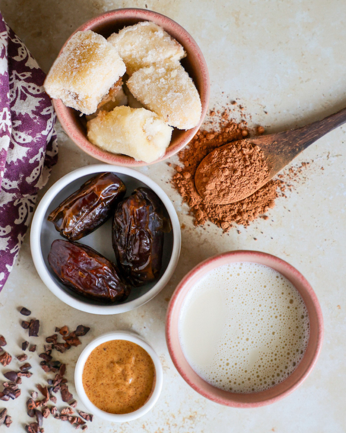 Cacao smoothie ingredients on a counter.