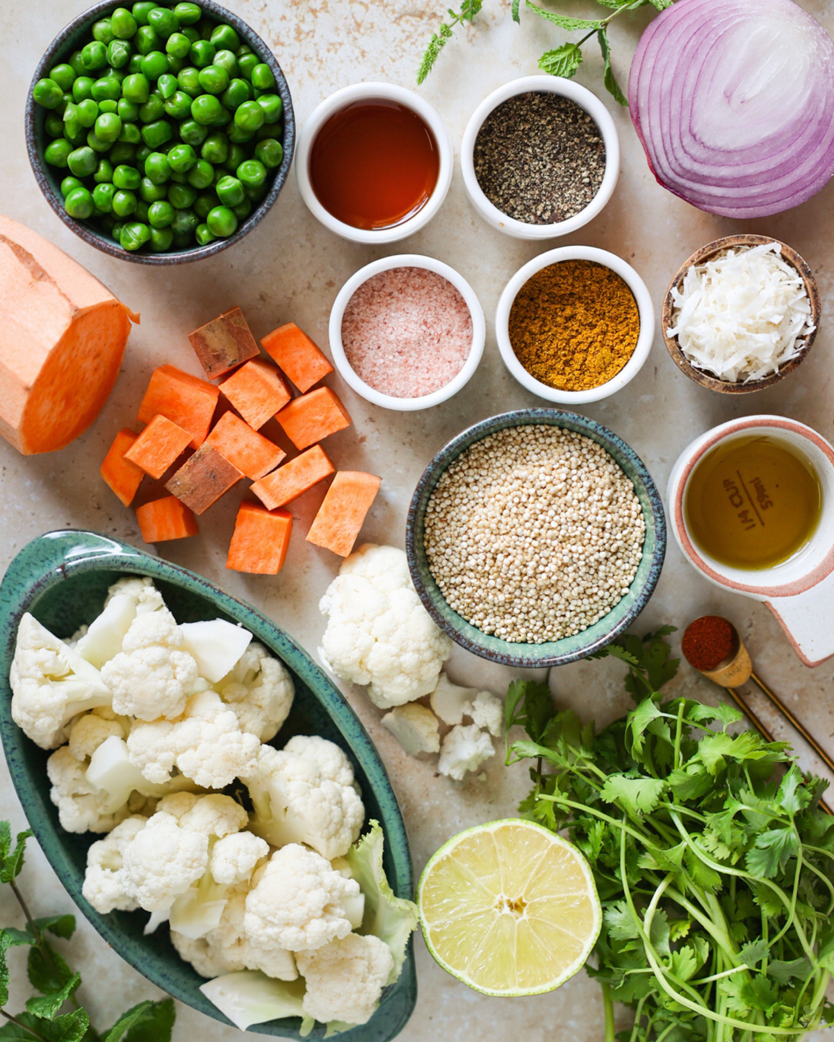 Arrangement of cauliflower salad ingredients on a counter.