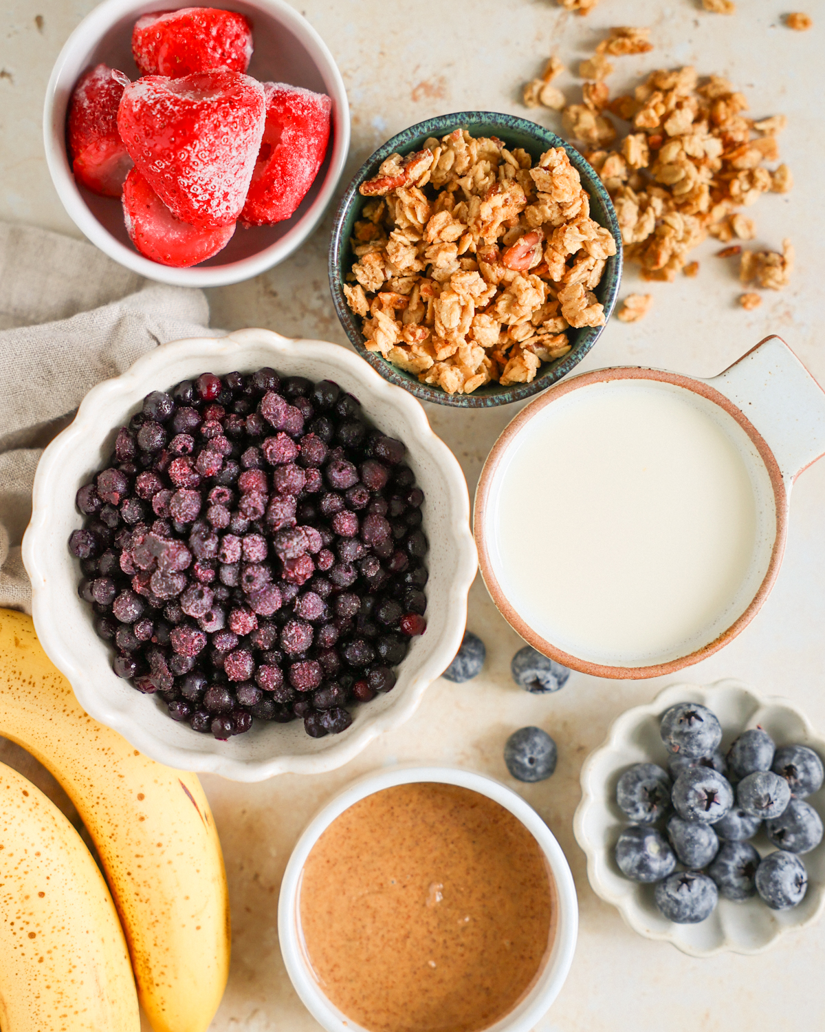 Smoothie bowl ingredients on the counter.